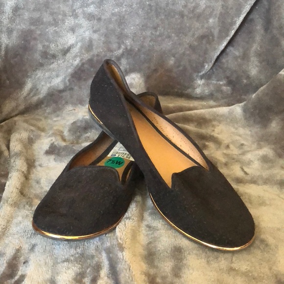 black flats with gold trim